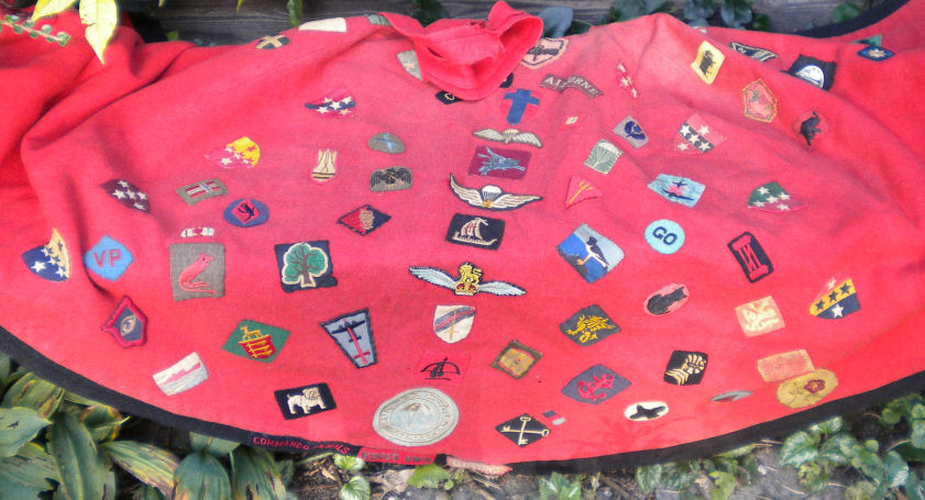 Soldier's badges of the inside of Celia Packe's VAD cape