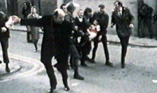 One of the injured is carried to safety, Bloody Sunday, 1972