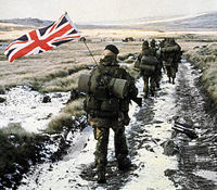 British troops yomp (march with heavy load over difficult ground) to Port Stanley in the Falklands war, 1982