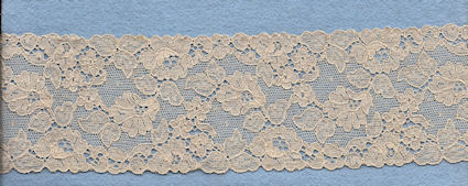 Flowery machine lace with gimp on one side