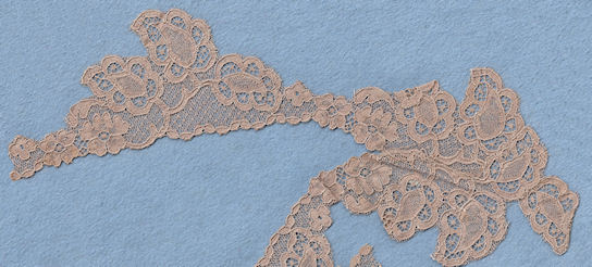 Machine lace cut to shape