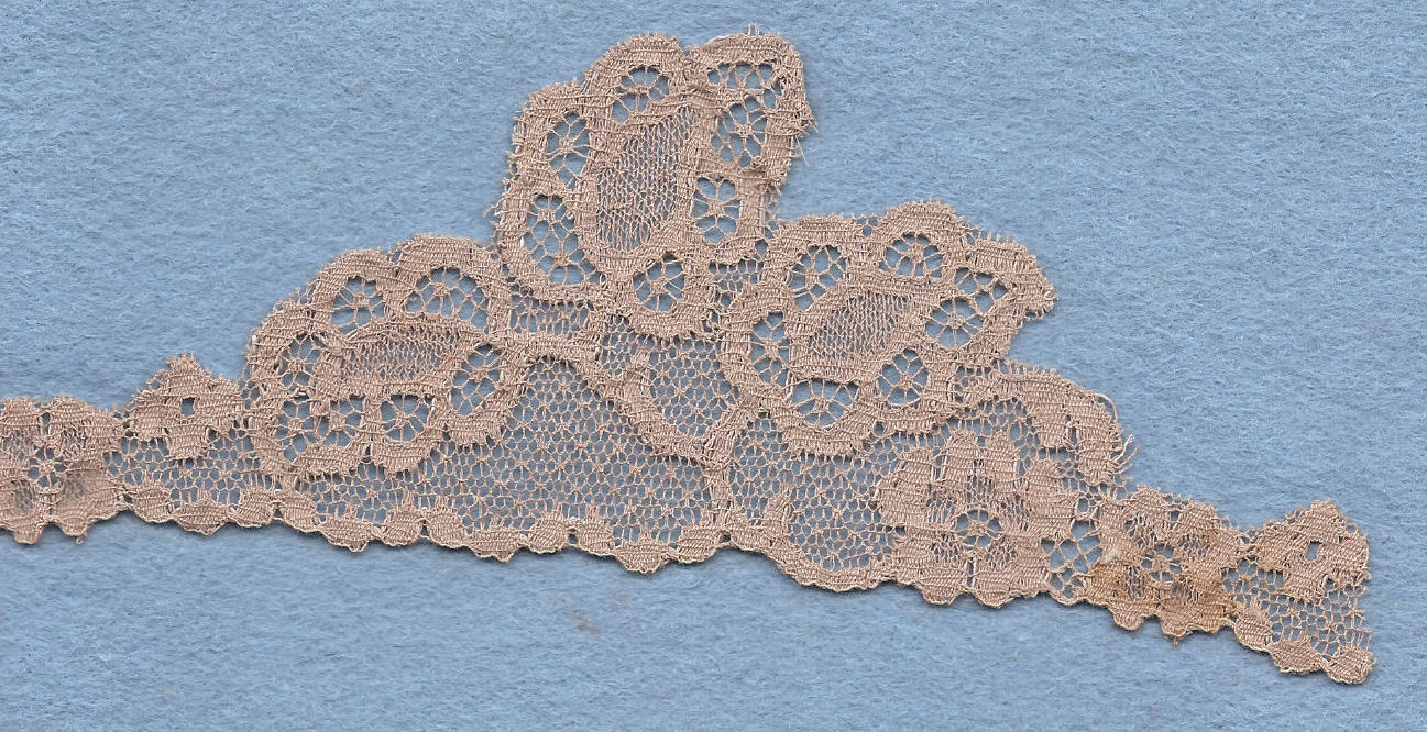 Machine lace cut to shape