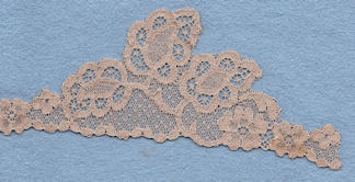 Machine lace cut to shape