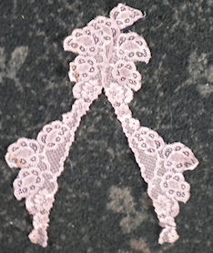 Machine lace cut to shape