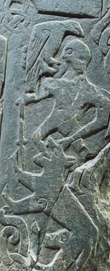 Odin with raven, being swallowed by the wolf, Thorwald Cross, Isle of Man