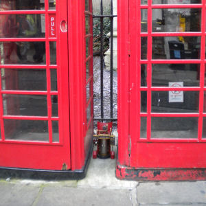 Dinky door between phone boxes, Gt St Mary's